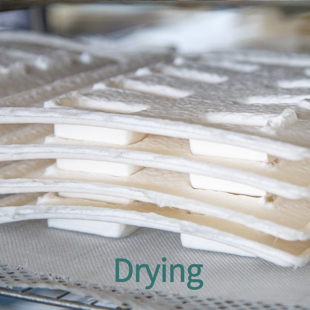 Step 3: Drying - Formed pieces solidify through heat or air drying