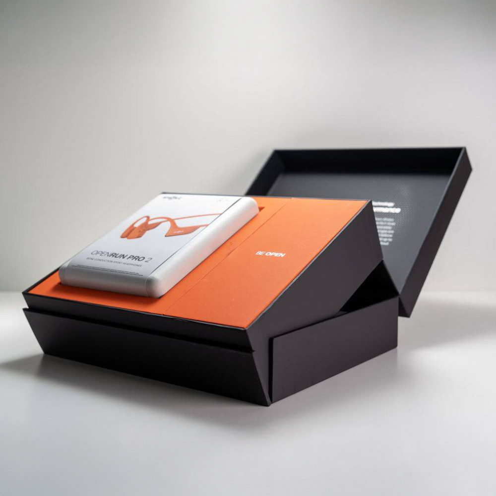 Close-up of sustainable molded pulp packaging with Shokz branding